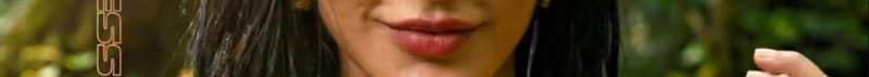 Close-up of a woman's lips and lower face with dark hair, holding a cigarette outdoors.