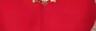 Close-up of a red fabric dress neckline with a small gold necklace.