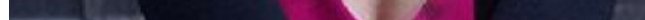 Close-up of dark navy fabric with a bright pink accent.