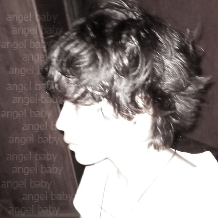 High contrast sepia profile portrait of a person with curly dark hair, repeating "angel baby" tex...