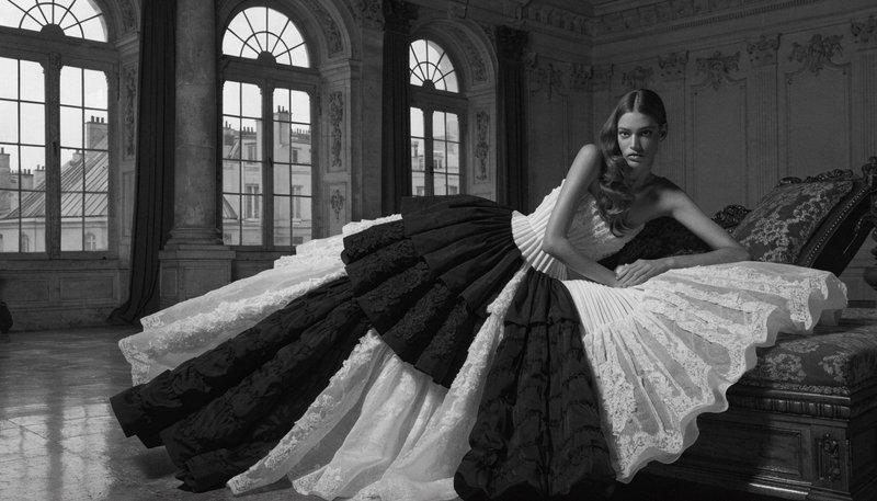 Richard Avedon + Peter Lindbergh + Paris Haute Couture grandeur, where Avedon's tonal extremism creates sculpted presence through blown-white luminosity and inked blacks with surgical edge definition, Lindbergh's cinematic grain produces atmospheric weight via silver-gelatin softness and storm-gray midtones, and haute couture infuses ceremonial hush and lacquered refinement. The fusion manifests as razor-sharp chiaroscuro, velvet shadow gradients, and architectural compositional poise, transforming any subject through platinum-to-obsidian tonal range, directional key lighting that carves dimensional form, and a charged monochrome atmosphere of theatrical restraint.
Direct, bold eye contact, classic female figure study, reclining, stretching in a studio