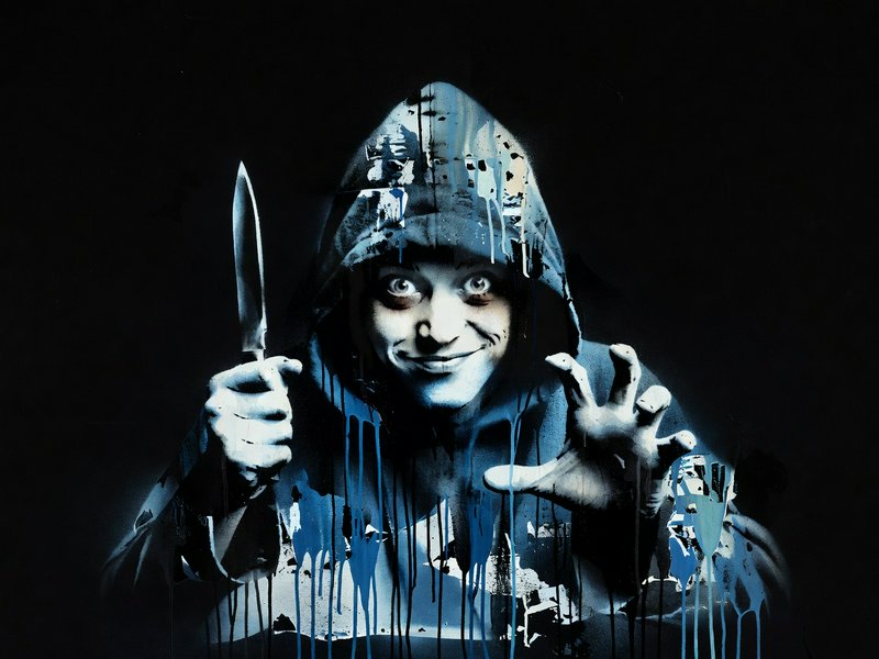 Unsettling grinning hooded figure holding a knife, rendered in dripping stencil art against a black background