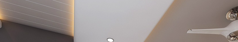 Modern interior ceiling with recessed lighting and a white ceiling fan blade