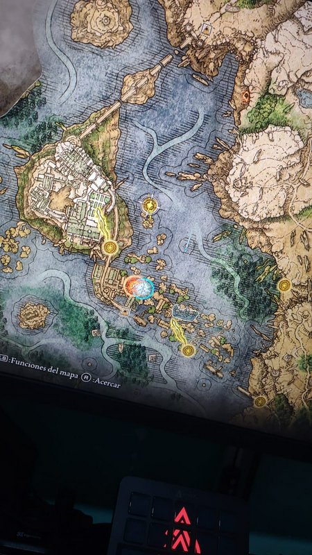 Detailed fantasy game map on screen showing islands, water, bridges, and markers.