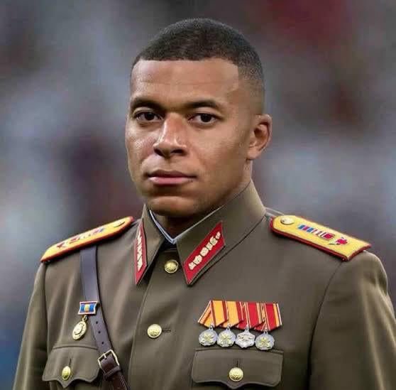 Portrait of a young soldier in a formal military dress uniform with medals and insignia.