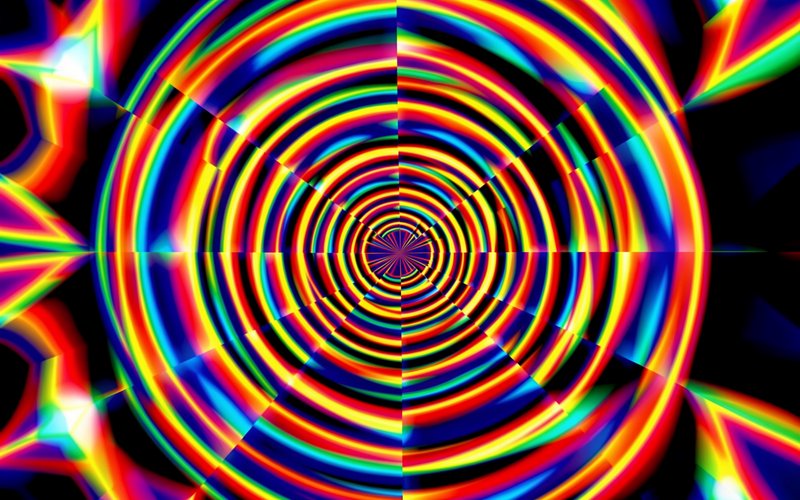 Symmetric glowing rainbow spiral tunnel psychedelic abstract art on a solid black background