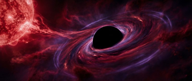 Silhouette of a black hole with a glowing, swirling accretion disk in red and blue hues against d...