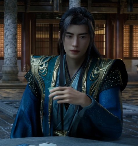 Young man in ornate blue-gold wuxia costume sitting at a table in a temple setting.