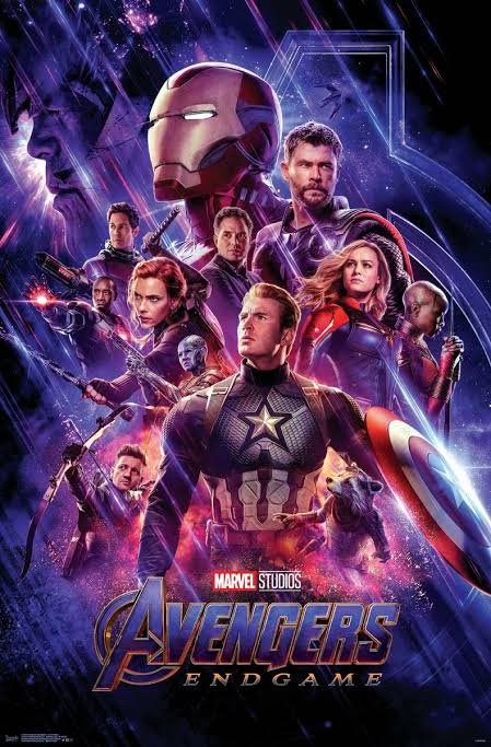 Official Avengers Endgame Marvel movie poster featuring core Avengers heroes posed against a glow...
