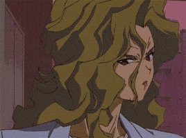 Anime-style woman with voluminous wavy hair and a stern expression, wearing a light blue blouse.