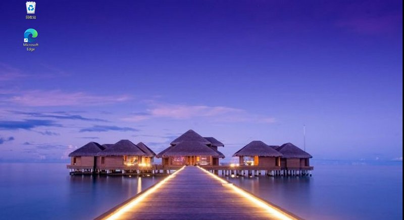 Overwater bungalows on calm sea with glowing walkway at purple twilight