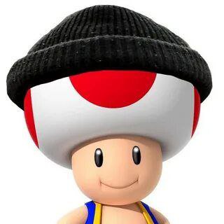 Smiling cartoon mushroom character wearing a black knit hat.