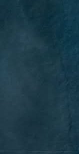 Close-up of a dark teal velvet texture with subtle gradients and depth.