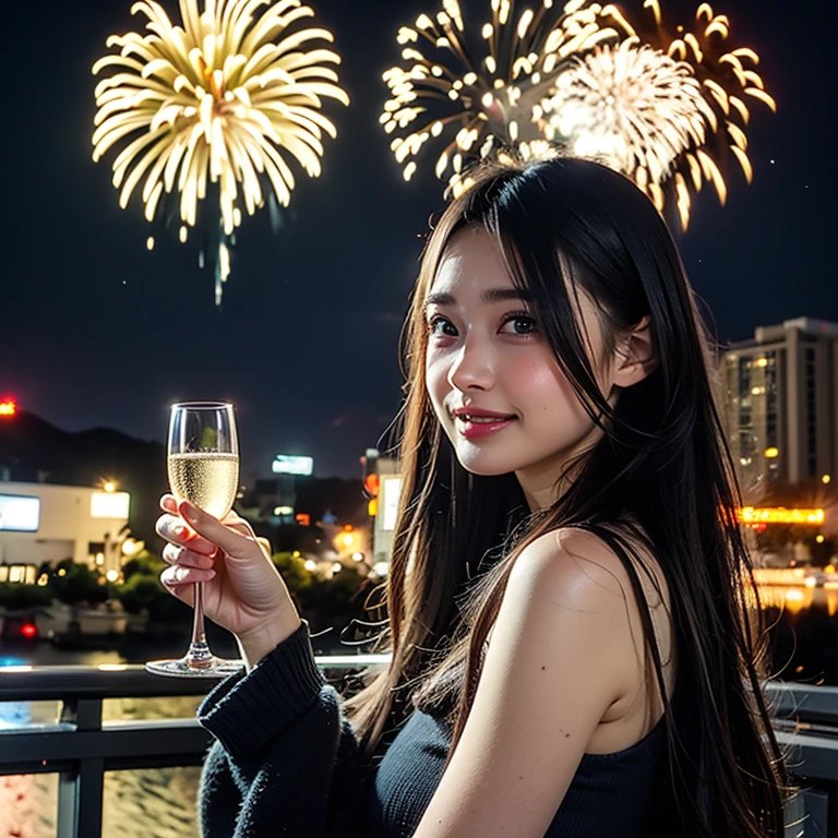 Young smiling woman holds a champagne flute, with golden bursting fireworks over a lit city night sky on a rooftop balcony.