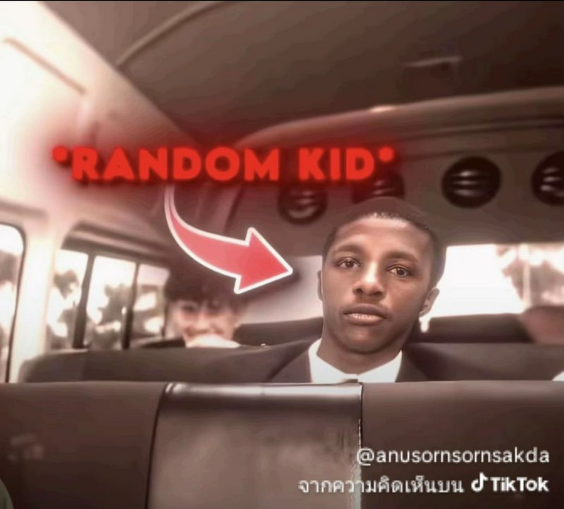 Portrait of a man on a bus with a red "RANDOM KID" meme caption and arrow overlay.