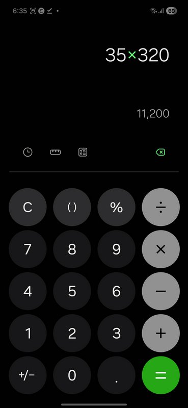 Dark-mode calculator app on a smartphone screen with large circular buttons and a 35×320 display.