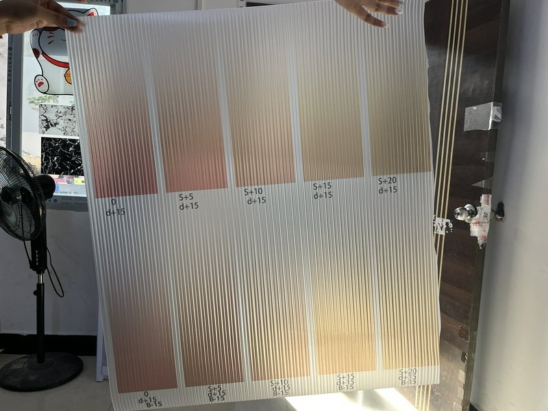 Large translucent panel with vertical ridges displaying a gradient of peach to beige color swatches.