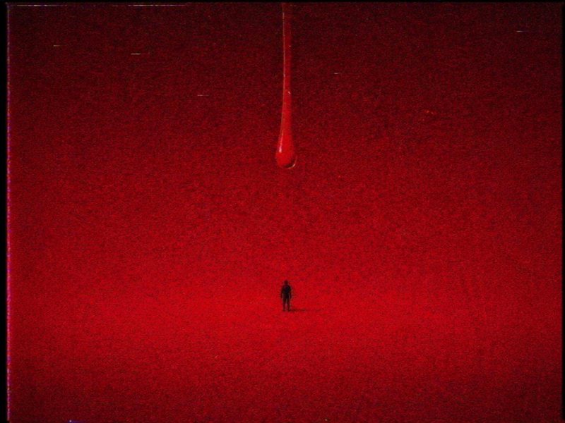 A lone silhouette stands in a vast red landscape beneath a dripping red liquid from above.