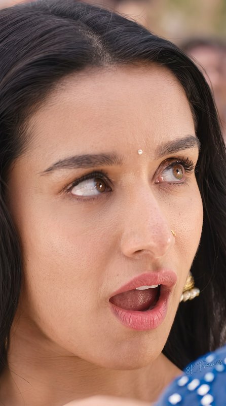 Close-up portrait of surprised Shraddha Kapoor wearing a bindi, nose stud, traditional jewelry, a...