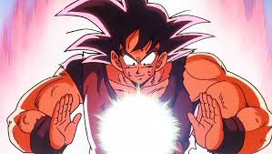 Goku from Dragon Ball Z in Super Saiyan form, palms forward, generating a bright energy ball.