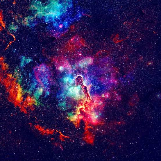 Colorful space nebula with vibrant hues of blue, green, red, and purple amid a star-filled dark b...