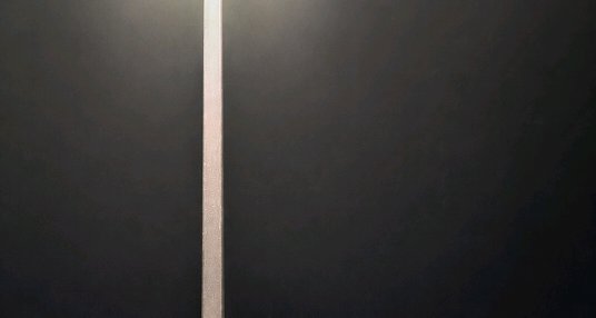 Thin glowing pale light sliver peeks through the narrow gap between closed matte black double doors.