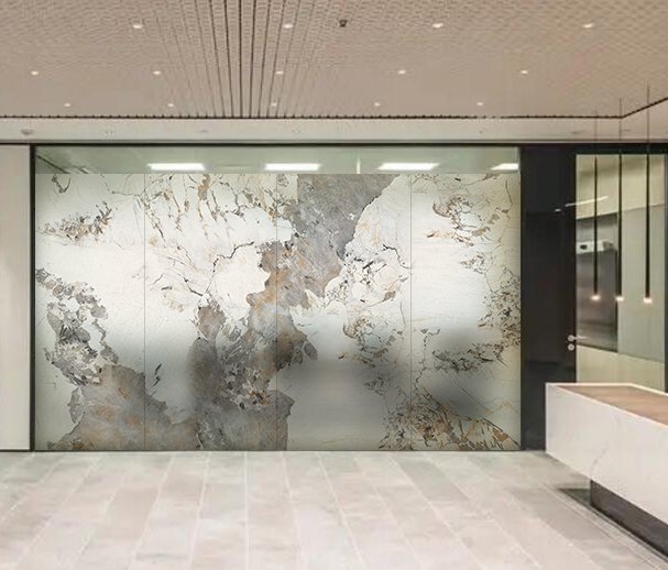 Large frosted glass wall with abstract marble pattern in a modern office lobby.