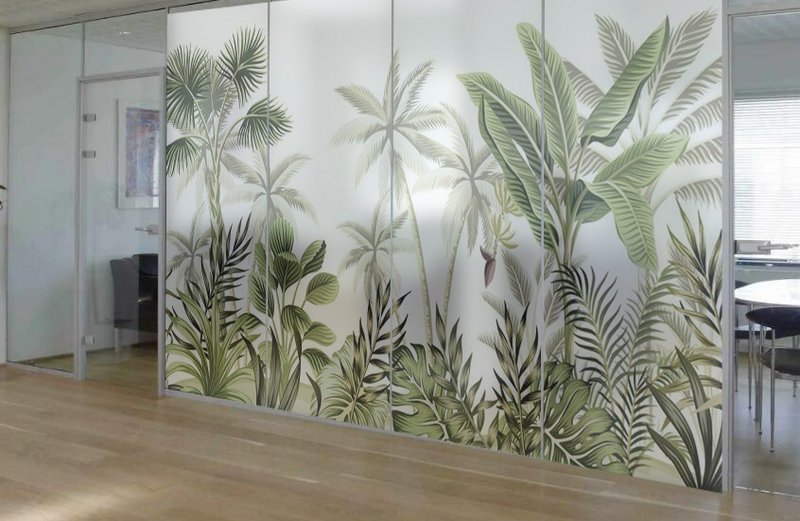 Glass wall mural with tropical jungle plants in a modern office space.