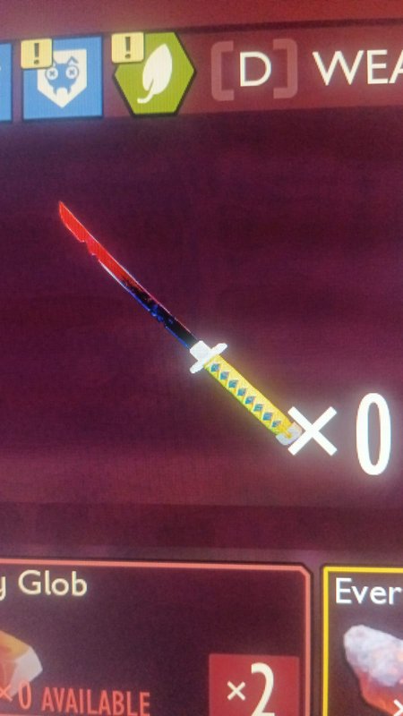 In-game glowing katana with a yellow diamond-pattern handle and red blade, shown over a game UI.