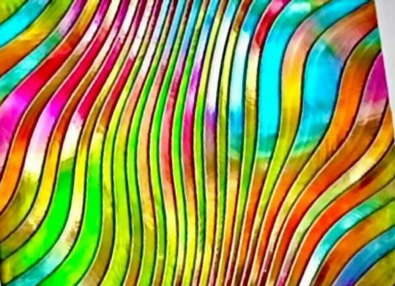 Colorful wavy stripes in an abstract rainbow pattern forming flowing curves.
