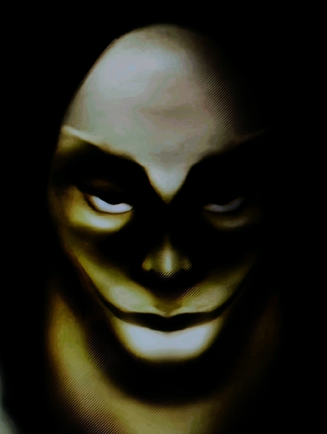 Dark hooded figure with a pale, sinister face emerging from shadows.