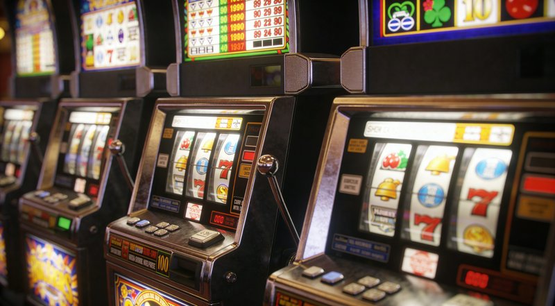 A row of classic slot machines on a dim casino flo | DavidP on ...