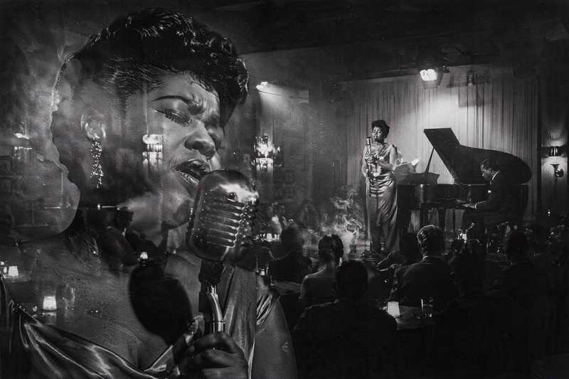 [Double exposure black and white shot of a female jazz vocalist singing in a smoky 1950s jazz club, with stage, piano, and...