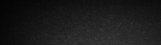 Wide dark charcoal grungy stone texture banner background, with subtle uneven grain and a soft bo...