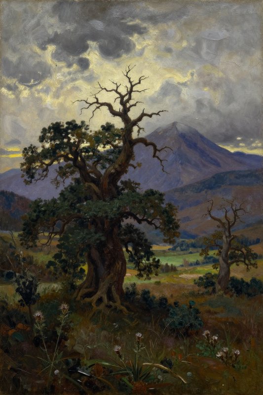 Old gnarled tree in a valley with distant mountains and moody, dramatic clouds.