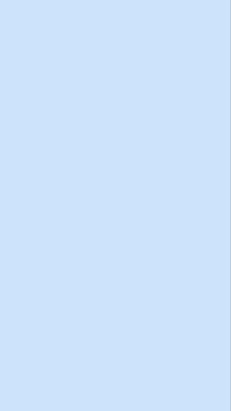 Solid smooth pale baby blue background with a thin faint vertical line along the far right edge
