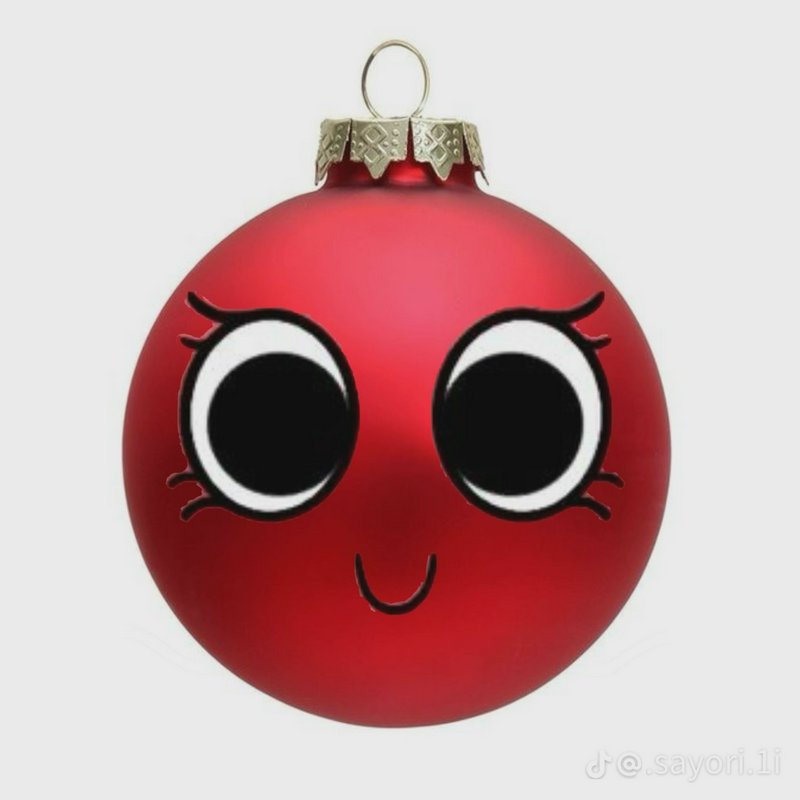 Red Christmas ornament with oversized cartoon eyes and a small smile.