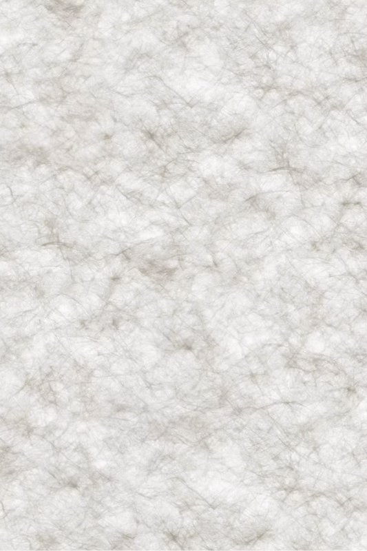 Close-up of a textured, fibrous handmade paper with neutral beige-gray tones