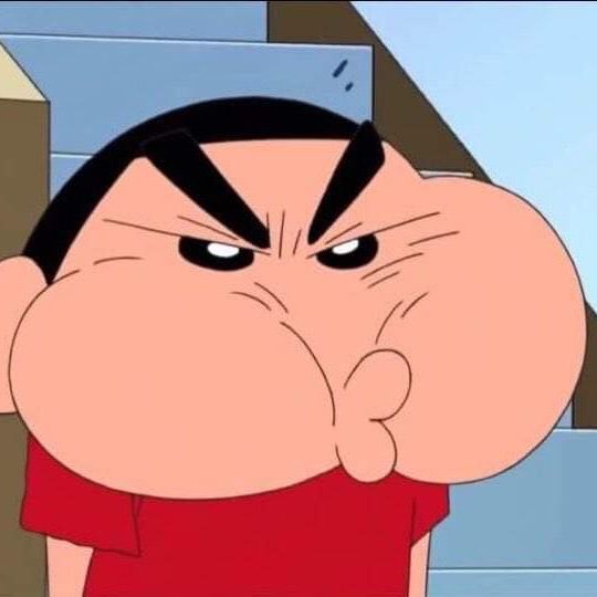 Closeup of angry puffed-cheek Shin Chan from Crayon Shin Chan making an exaggerated indignant fac...