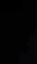Near-black abstract background with subtle texture and faint lighting.
