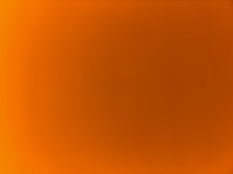 Solid orange gradient background with warm amber tones.