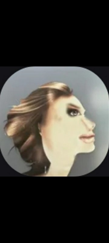 Profile portrait of a woman with windblown hair in a circular frame.