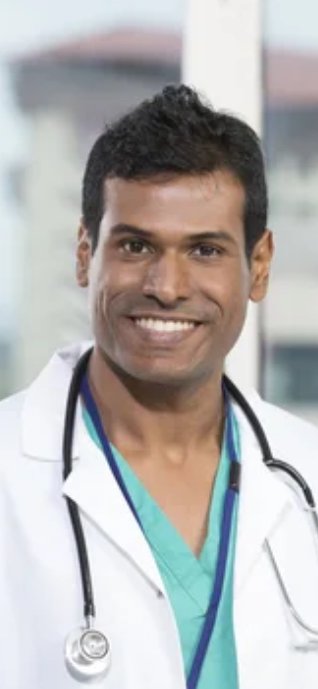 Smiling male doctor in white coat with stethoscope.