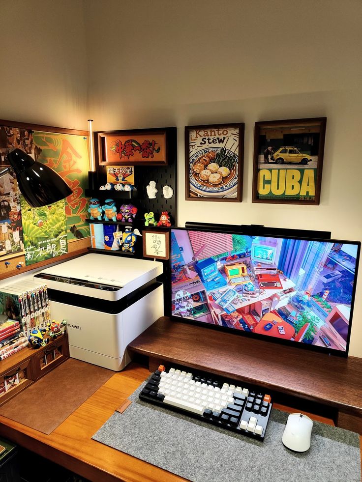 Cozy curated hobby gaming desk setup with anime art, pop culture figurines, and warm ambient lighting