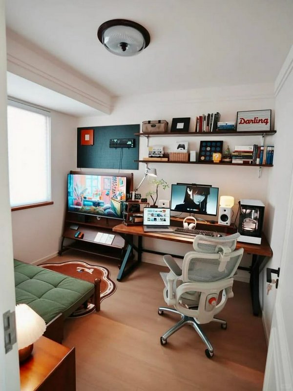 Sunlit compact cozy home office gaming setup with wooden desk, ergonomic chair, floating shelves,...