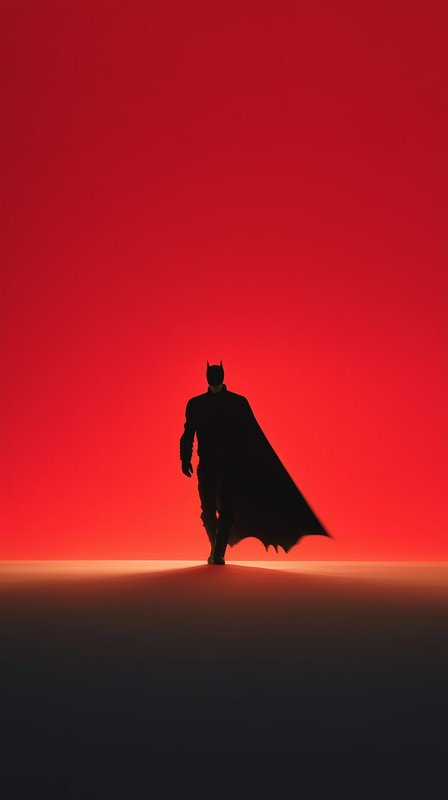 Black silhouette of Batman walking forward with billowing cape, against a bold saturated red grad...