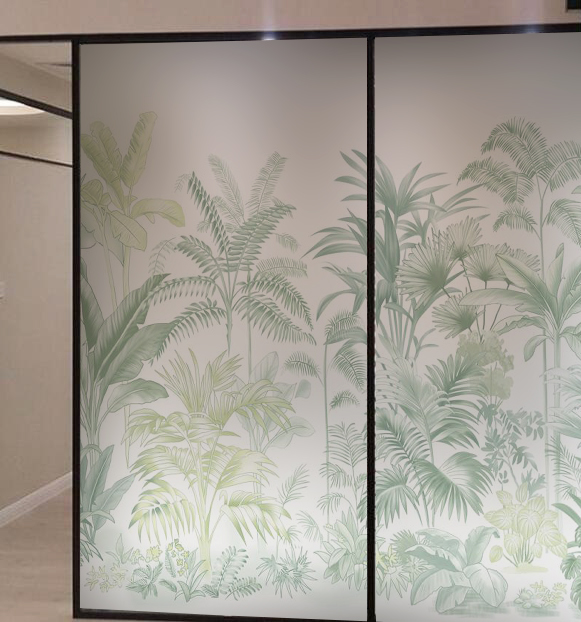 Frosted glass room divider featuring green tropical plant silhouettes.