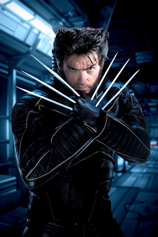 Hugh Jackman as Wolverine crosses arms with extended adamantium claws, intense confrontational st...