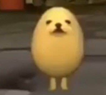 Small yellow chick-like egg character with a simple face standing on a gray surface.