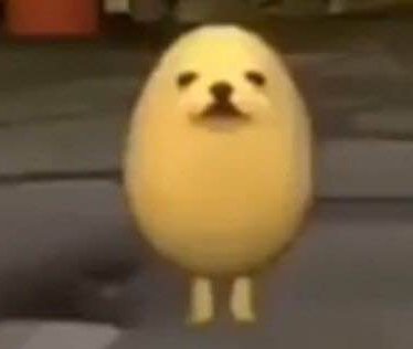 Cartoon yellow chick standing upright with a cute, simple face.